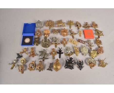A collection of British Cap badges, to include Fife and Forfar, Notts & Derby, London Rifle Brigade Cadets, The Kings Royal R