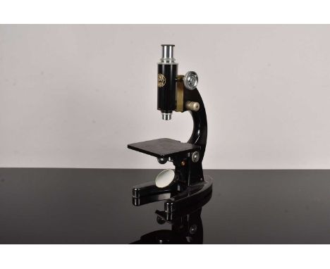 A C.Baker of London Monocular Microscope, number 34634, with three various objectives and a spare eyepiece, with another C.Ba
