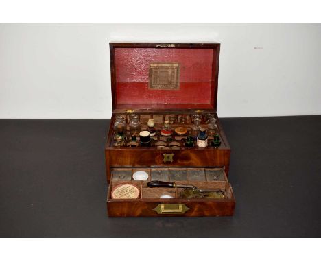 A vintage Apothecary Set, having a Bought of Brattan &amp; Co label to the inner lid, comprising of various bottles, a set of