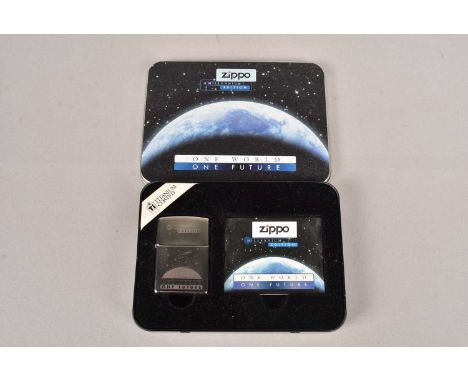 Zippo Millennium Edition, One World One Future, Titanium Coated Zippo, dated 1999, with retailers tin,  unused