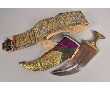 A Middle Eastern Jambiya, having two yellow metal tokens applied to the handle, together with scabbard with applied white met