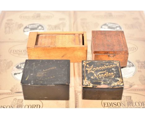 Two papier-mache gramophone needle boxes, both for Zonophone, together with two wooden examples, one with a tambour lid and t