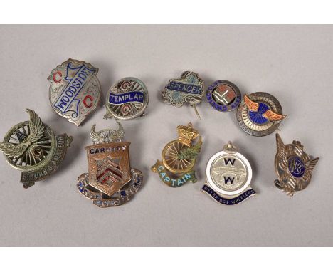 An assortment of Cycling medals and buttons, to include a Bath Cycling Club silver and enamel button, hallmarked Birmingham 1