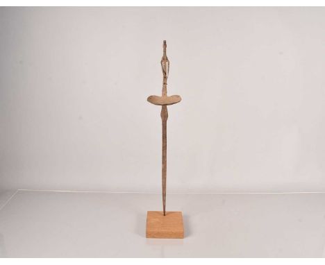 An African Ritual Iron Oil lamp, of figural design with large dish, with later made wooden base, 65cm H