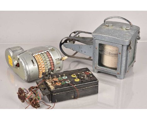 A vintage Almex Ticket Machine, together with an Air Ministry Bomb Release Unit, possibly from a Lancaster Bomber, plus a Sei