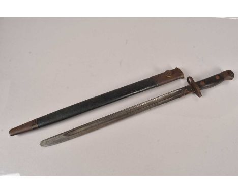 A 1907 Pattern SMLE Bayonet by Wilkinson, having multiple stamps to the base of the blade, complete with scabbard, AF, no pos