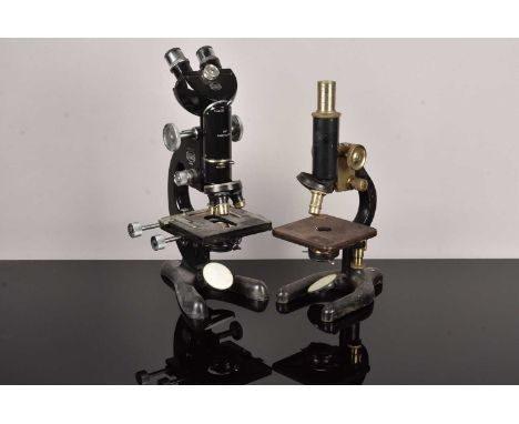 A Beck Model 48 Microscope, circa 1940, marked 'Beck London, 23206', with interchangeable binocular-monocular heads, together