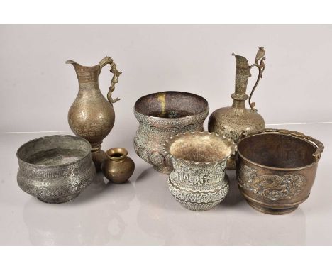 A group of Middle Eastern metalware, of various sizes and shapes, with decorative designs, one having a hunting scene, anothe