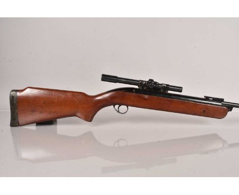 A BSA .22 Break Barrel Air Rifle, serial T887, having small moderator to the end of the barrel, complete with scope, 18+ TO P