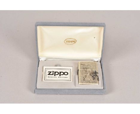 Freeclimber, Limited Edition Zippo Lighter, dated 1996, 1360/3000, with an applied figure scaling the side of the lighter, in