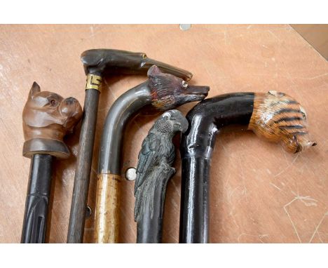 A group of five Animal Head topped walking canes, comprising a whippet/greyhound, a bulldog, a fox, a tiger and a cast metal 