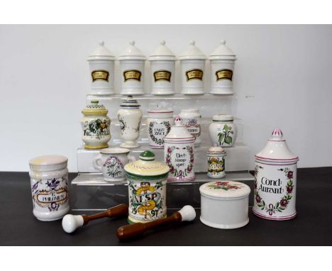 A group of five white ceramic Apothecary jars, each with similar gilt and black label, together with a selection of others, o