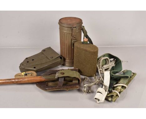 A German Gas Mask within Cannister, together with two different era shovels/entrenching tools, a water canteen, frogs and mor