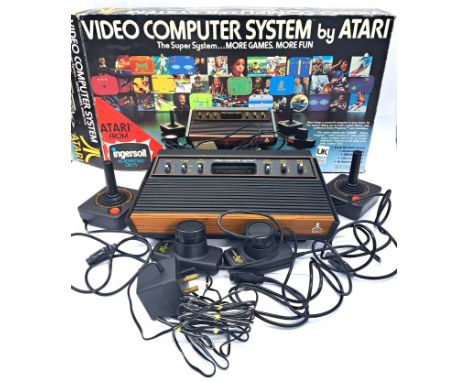 Vintage/Retro Gaming. A boxed Atari CX2600 Computer System comprising of Console, Hand Controllers, Paddles and power supply.