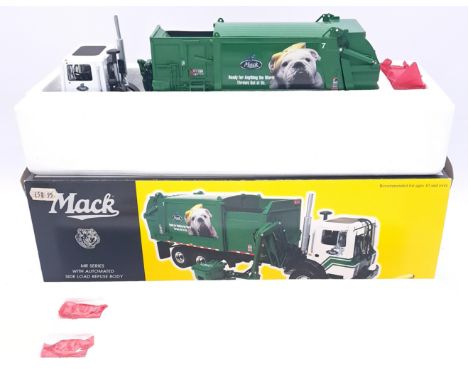 First Gear, a boxed 1:34 scale Mack Truck - Mr Series With Automated Side Load Refuse Body "Ready For Anything The World Thro