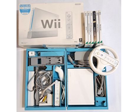 Vintage/Retro Gaming. A boxed Nintendo Wii "Sports" Set along with Steering Wheel &amp; Controller and Games. Condition appea