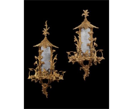 A pair of George III style giltwood carved girandolesin the Chinese Chippendale styleEach with rectangular plates with pagoda