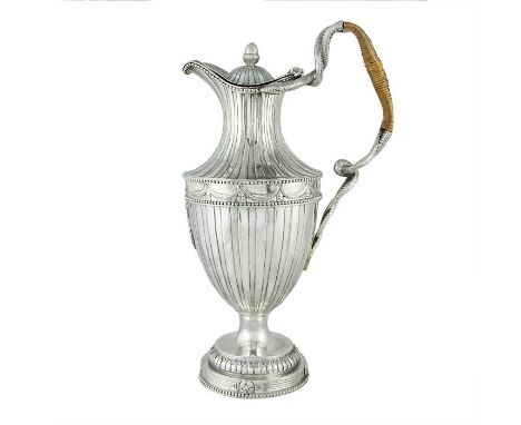 A George III silver bead-edged ewer by William Holmes & Nicholas Dumee, London, 1773The vase-shaped body and waisted neck str