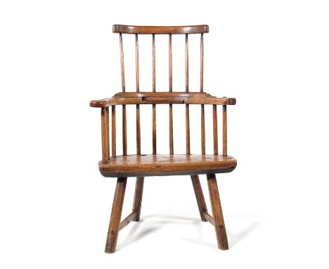 A George III ash stick-back Windsor armchair, probably Welsh
With three-part armbow and solid plank seat on splayed beech leg