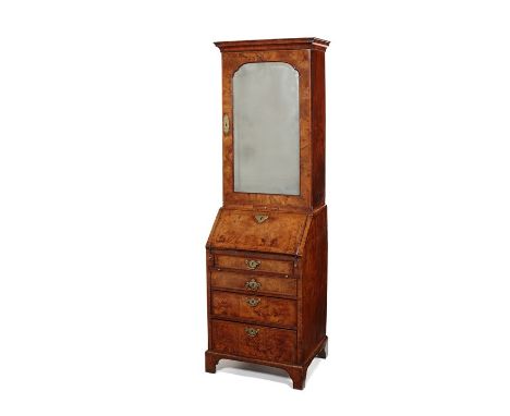 A small George II figured walnut crossbanded and featherbanded bureau bookcase
In two parts, the upper part with a rectangula