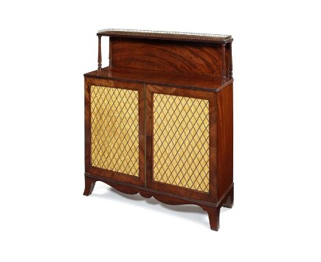 A Regency mahogany chiffonier
The rectangular top with reeded edge and pierced brass three-quarter gallery on fluted turned s
