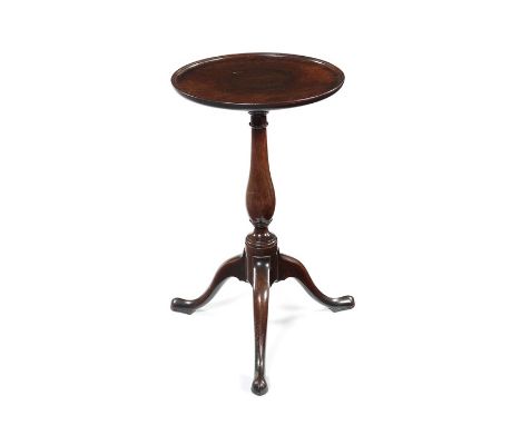 A George III mahogany kettle standThe circular dished top with a pull-out slide below, on a baluster turned column and tripod