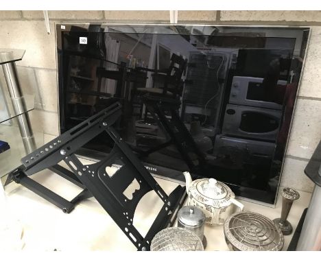 A Samsung flat screen TV &amp; wall bracket