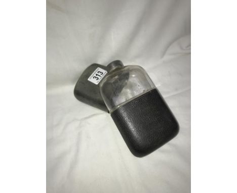 An old pewter and glass spirit flask