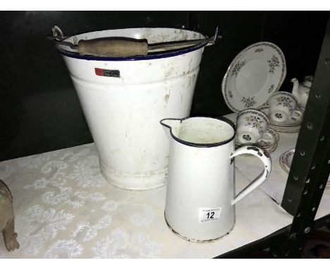 A vintage enamel slop bucket and a jug