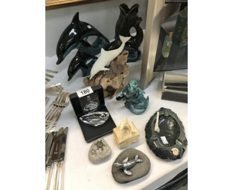 A mixed lot of Dolphin and other sea life including: Poole Pottery, Darmouth Pottery, Mats Jonasson Glass, Hornsea Pottery et