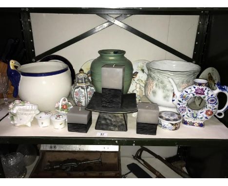 A shelf of pottery and porcelain including Coalport collectors plates