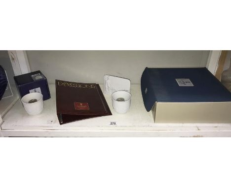 A boxed Lladro gift set and a boxed Lladro ship candle holder