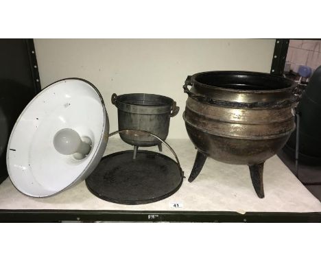 An industrial ceiling light cauldron etc.