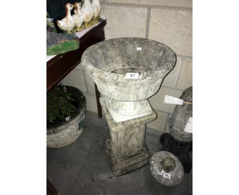 A concrete planter on plinth