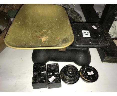 A set of cast kitchen scales and weights