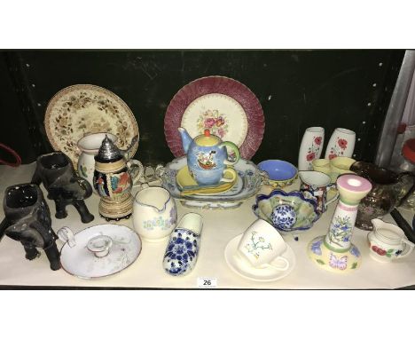 A shelf of miscellaneous pottery and porcelain