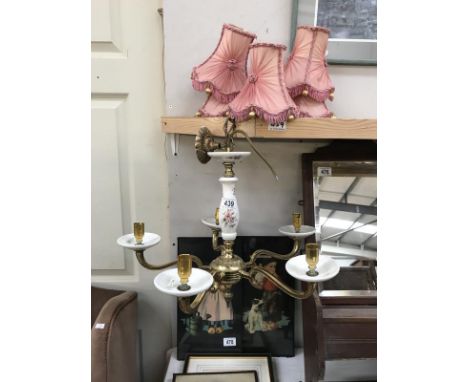 A floral porcelain and brass, five arm ceiling light with shades.