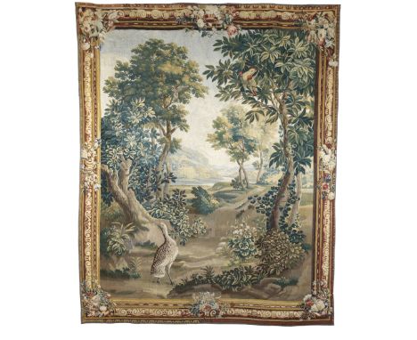 A charming Aubusson verdure tapestrylate 18th centurythe idyllic landscape with verdant foliage and prunus to the foreground,