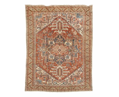 A vibrant Serapi carpetNorth West Persia,with typical medallion and lozenges of geometric form, with vibrant blues, reds and 