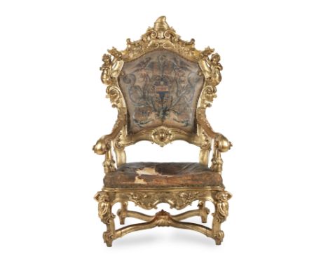 A large Italian third quarter 18th century giltwood armchair or throne chairof Venetian originThe frames carved with acanthus