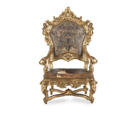 A large Italian third quarter 18th century giltwood armchair or throne chairof Venetian originThe frames carved with acanthus