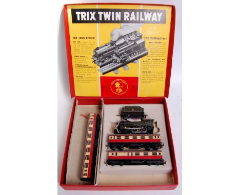 A Trix Twin Railway red set box containing BR green 'Pytchley' engine and tender, 2 short red/cream coaches and an additional