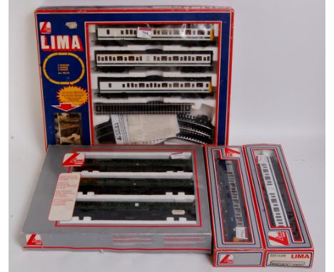 A Lima class 117 DMU train set, BR white/blue, with track, appears complete (G-BG), spare white blue centre car (M-BM), BR gr