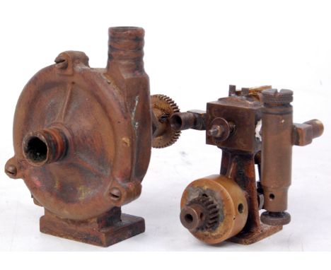 Of freelance design a small brass and gun metal single oscillating cylinder vertical engine, sold with a brass steam powered 