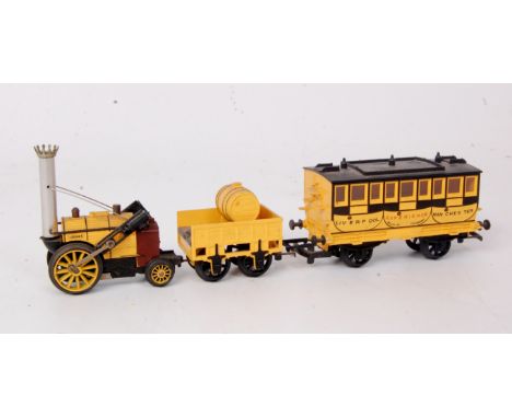 A Triang 'Rocket' engine and tender together with L&M 'Experience' coach (G)