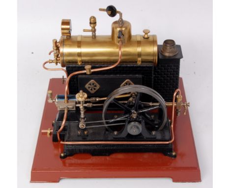 Bing or similar, restored horizontal single cylinder engine, brass boiler on tin brick effect plinth, new 4 wick spirit burne