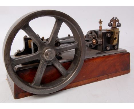 A well made stationary horizontal mill engine, comprising of single cylinder with double acting action, powering a 6 inch spo
