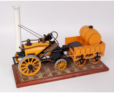 Hornby Railways 3 ½ inch gauge Stephensons Rocket locomotive and tender mounted on a display track, sold with a loose carriag