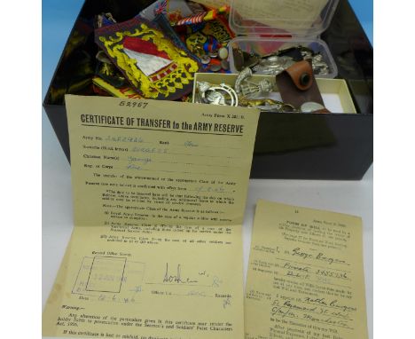 A collection of military badges, compass, cloth badges, documents, etc.