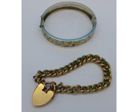 A silver and gold applied bangle and a plated bracelet